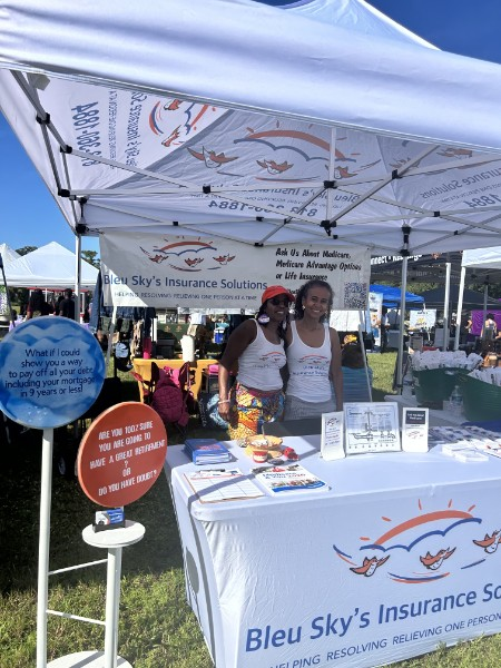 Bleu Sky's Insurance Solutions team welcoming visitors at an outdoor community event